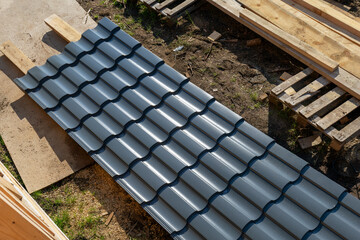 Obraz premium Sheet of metal tiles on a construction site.