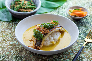 Indonesian curry with crispy sea bass and rice