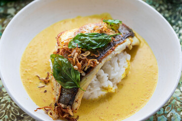 Indonesian curry with crispy sea bass and rice