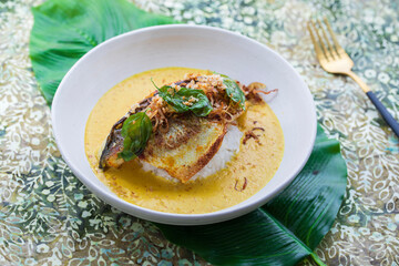 Indonesian curry with crispy sea bass and rice