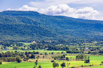 Natural background, high angle view from the observation point, blurred golden rays of the sun visible. The mountains that were setting on the horizon, changed beautifully with the wind.