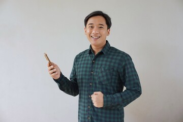 people, person, smile, handsome, casual, shirt, smiling, happiness, expression, confident, looking, model, face, one, hand, adult, arm, asian, background, camera, cheerful, communication, concept, fis