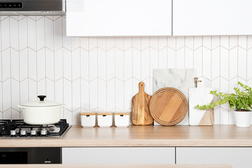 Kitchen utensils on modern home kitchen countertop, front view background with empty space for text