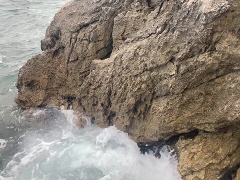 Sea waves against stones