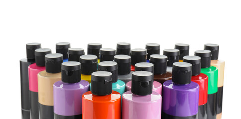 Acrylic paints of different colors in bottles isolated on white