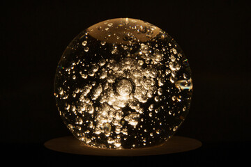 Glass round lights with air bubbles inside for anniversary or christmas and New Year party decorations and gifts.