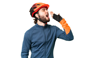 Young cyclist man over isolated chroma key background yawning and covering wide open mouth with hand