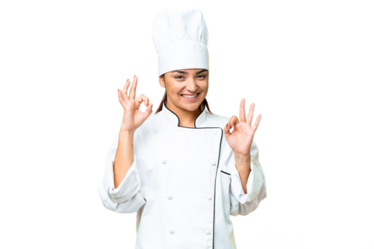 Young woman Chef over isolated chroma key background showing an ok sign with fingers