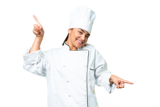 Young woman Chef over isolated chroma key background pointing finger to the laterals and happy