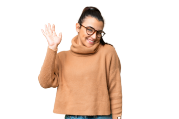 Young beauty woman over isolated chroma key background saluting with hand with happy expression