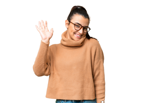 Young beauty woman over isolated chroma key background saluting with hand with happy expression