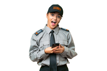 Young safeguard woman over isolated chroma key background surprised and sending a message