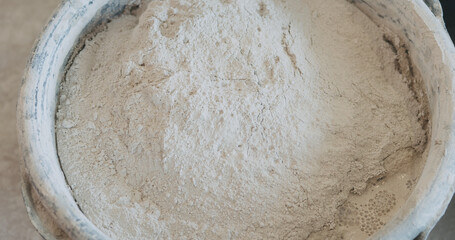 mixing concrete plaster with electric mixer