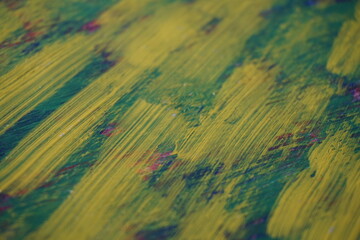 Mixed yellow acrylic paint splatter on top of a blue paint surface, Multicolor  paint splash...