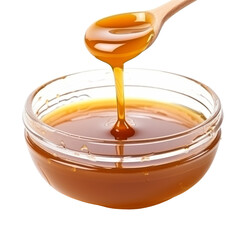 Golden Caramel Syrup Dripping from Spoon into Glass Bowl.