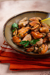 mussels no shell, boiled, mussels, peeled, in a bowl, with lemon and parsley, Chilean mussels, top view, no people,
