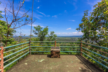 Background of various species of trees growing on the foot of the mountain, on the high rocks on the mountain top, beautiful ecosystem, fresh air.