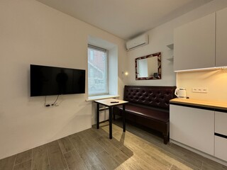 Stylish and Functional Mini Kitchen in a Modern Studio Apartment