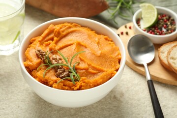 Delicious mashed sweet potatoes served on light table, closeup