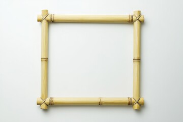 an empty picture frame made from bamboo on a white background