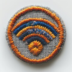 Close-up of a colorful embroidered wifi symbol on a fabric patch.
