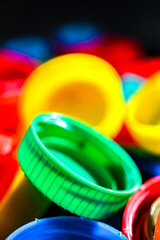 Different sorts of colorful plastic bottle caps. Recycling