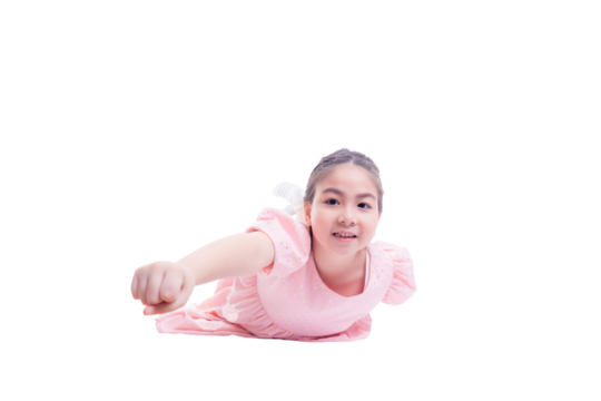 Young girl in a pink dress playfully poses as if flying, extending her arm forward in a superhero gesture, against a white background. The image captures a sense of imagination and childhood fun.