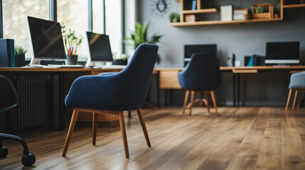 Modern office interior with cozy armchairs and computers arranged in a row on a hardwood floor. --ar 16:9 --v 6.1 Job ID: 6488d7bb-2c43-4b56-9e14-741edffee70e