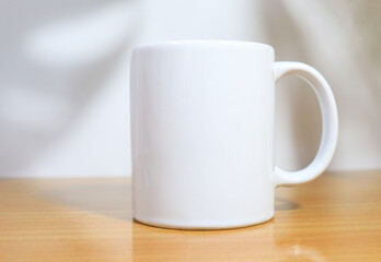 white cup on a wooden table