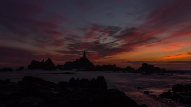  Corbiere lighthouse in Jersey at sunset 4k Time Lapse