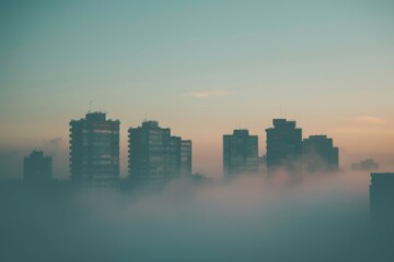 Fototapeta premium A misty urban landscape showcasing skyscrapers shrouded in fog, creating a mysterious atmosphere, Buildings fading into the foggy horizon, AI generated