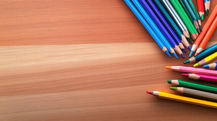 Fototapeta premium A vibrant collection of colored pencils arranged on a wooden surface, ideal for art projects and creative inspiration.