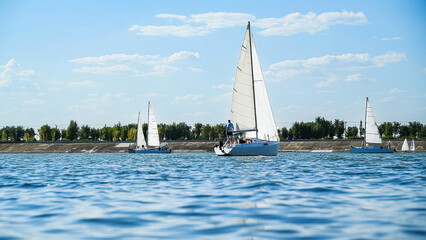 Fototapeta premium Sailboats compete in a sail regatta, race of sailboats