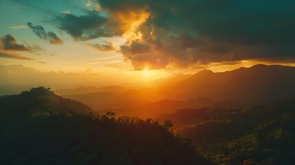 Obraz premium Sunset warm hues illuminate the flat mountain tops