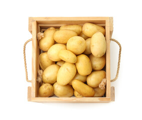 Young potatoes in wooden crate isolated on white, top view