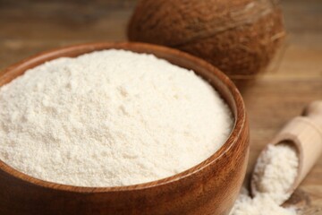 Coconut flour in bowl on table, closeup
