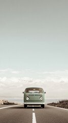 Vintage van on a coastal road under a clear sky during the day