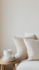 Cozy living space with white pillows and bowls on a wooden table