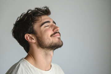 Fototapeta premium A close up of a man's face with his eyes closed