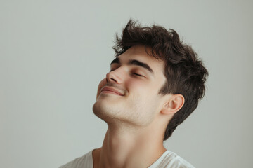 Fototapeta premium A close up of a man's face with his eyes closed