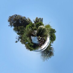 Little planet transformation of spherical panorama 360 degrees. Spherical abstract aerial view in forest. Curvature of space.