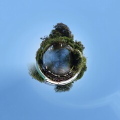 Little planet transformation of spherical panorama 360 degrees. Spherical abstract aerial view in forest. Curvature of space.