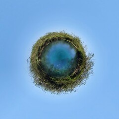 Little planet transformation of spherical panorama 360 degrees. Spherical abstract aerial view in field with grass. Curvature of space.