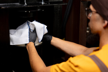 Worker pours sunflower to press on local production. Fresh extra virgin organic oil, healthy eco product