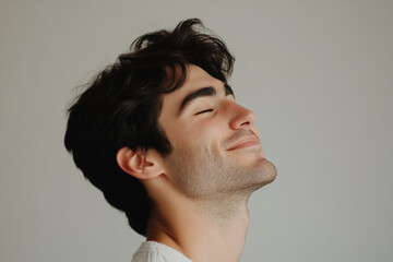 Fototapeta premium A close up of a man's face with his eyes closed