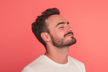 Obraz premium A close up of a man's face with his eyes closed