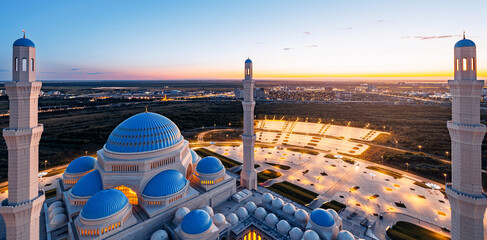 Astana Grand white mosque evening at sunset, Nur Sultan in capital of Kazakhstan, aerial view