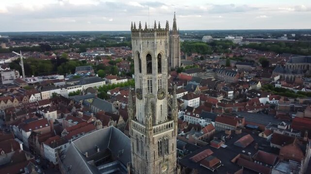 Aerial view of Brugge medieval architecture and iconic Belfry tower at sunset