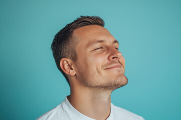 Obraz premium A close up of a man's face with his eyes closed