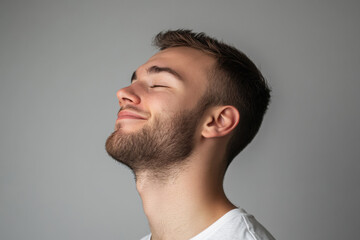 Obraz premium A close up of a man's face with his eyes closed